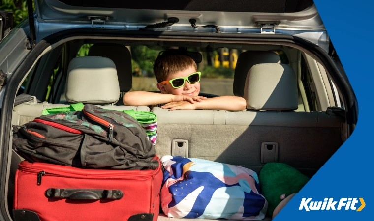 boot full of holiday stuff with a child in the back seat